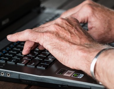 Old person and computer